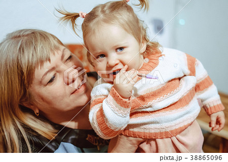 little girl standing at home 38865096