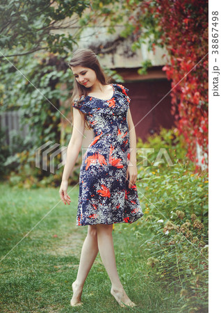 Smiling young brunette woman posing Smiling young brunette woman posing 38867498