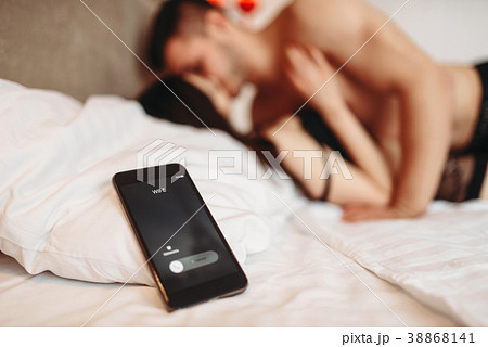 Lovers on big white bed, adultery concept 38868141