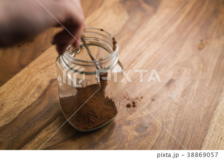 making cocoa drink in glass jar with handle on making cocoa drink in glass jar with handle on 38869057