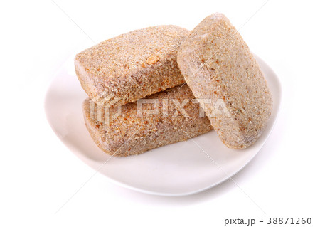 Frozen ground meat on a white plate Frozen ground meat on a white plate 38871260