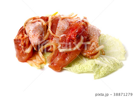 Raw sliced meat on a cabbage leaf 38871279