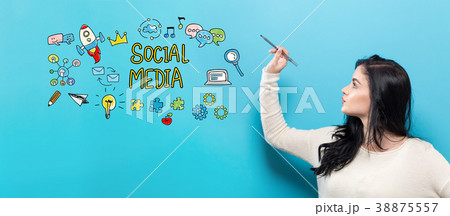 Social Media with young woman holding a pen 38875557