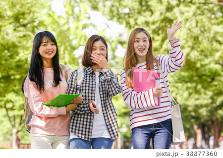 Campus life - freshmen enjoy theirs the campus life. young college students walking on around of campus. 084 38877360