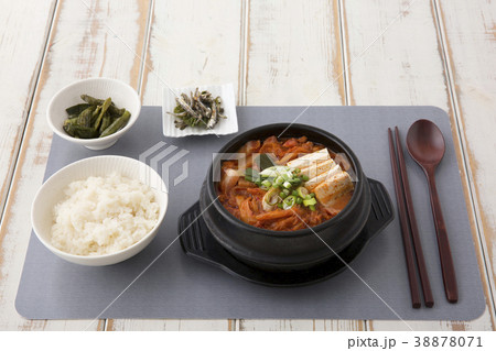Delicious Korean food - kind of noodles, soup with rice and side dish with fish on the table. 095 38878071