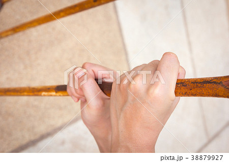 close up of hand on chain-link fence close up of hand on chain-link fence 38879927