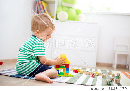 two years old child sitting on the floor with two years old child sitting on the floor with 38884170