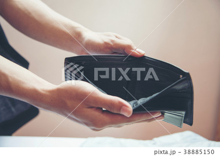 Unemployed man showing empty wallet. Unemployed man showing empty wallet. 38885150