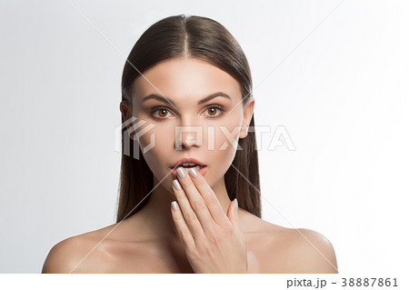 Shocked young woman with perfect natural makeup Shocked young woman with perfect natural makeup 38887861