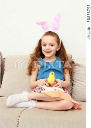 Cute little girl with bunny ears and cuddly toy 38888798
