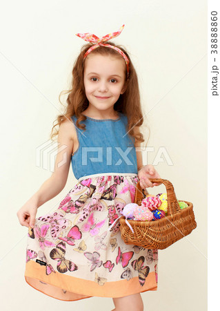 Adorable little girl playing with Easter eggs on Adorable little girl playing with Easter eggs on 38888860
