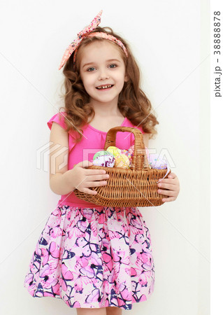 Adorable little girl playing with Easter eggs 38888878