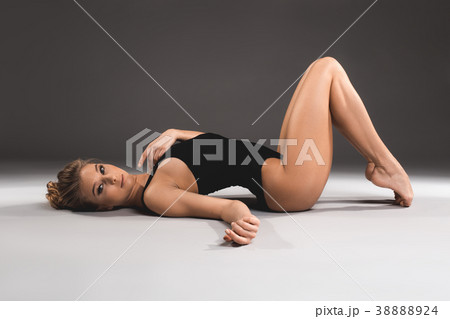 Beautiful fit woman reposing on the floor 38888924