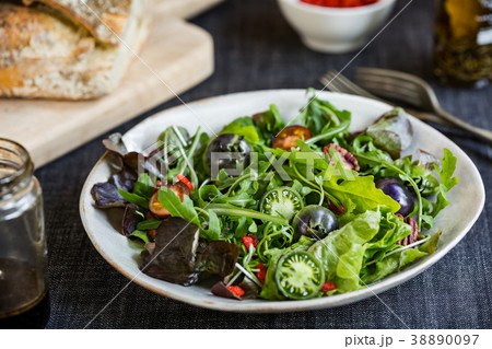 Green Salad with Green Tomatoes and Pecan Salad 38890097