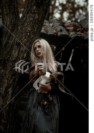 Witch in a long black dress 38890476