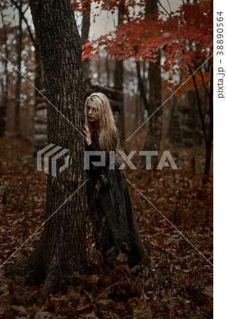 Witch in a long black dress Witch in a long black dress 38890564