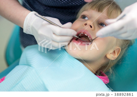 Baby girl visiting stomatology clinic.  38892861