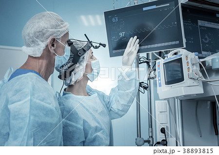 Smart occupied medics standing and looking at the Smart occupied medics standing and looking at the 38893815