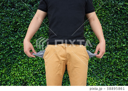 Man showing his empty pockets Man showing his empty pockets 38895861