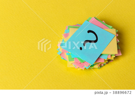Question mark paper heap on yellow background Question mark paper heap on yellow background 38896672