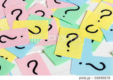 Just a lot of question marks on colored papers 38896678