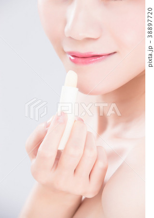 woman use lip balm woman use lip balm 38897720
