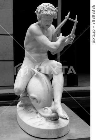 Ancient statue of a poet Arion with a dolphin 38898386