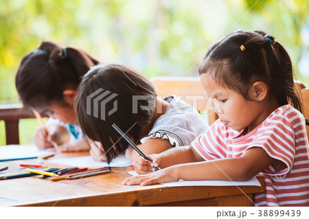 Group of asian children draw and paint with crayon 38899439