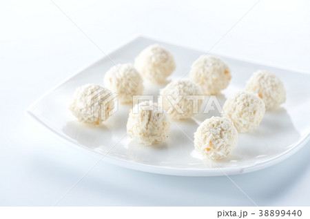 Coconut candies on white plate 38899440