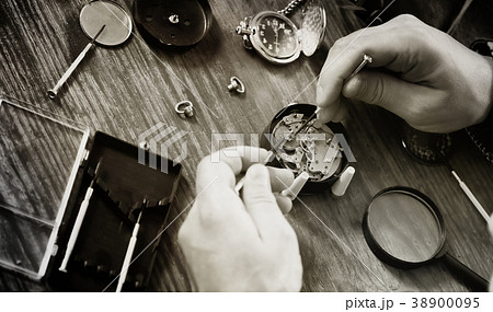 black and white photo watch clock repairing 38900095