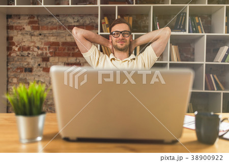 Young man with a laptop Young man with a laptop 38900922