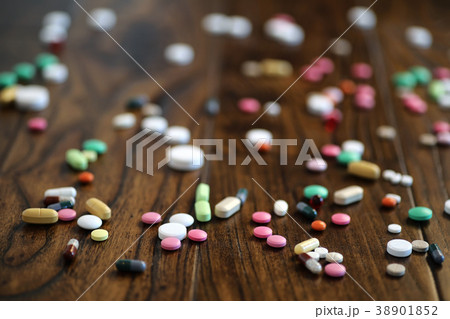 Multicolored tablets of different shapes and sizes 38901852