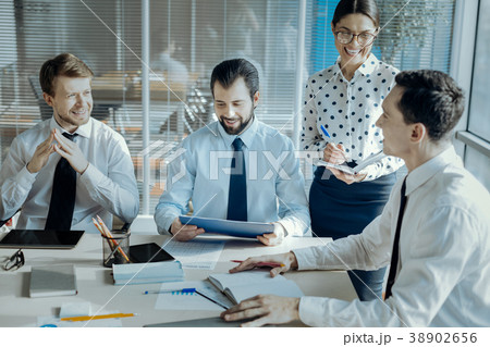 Close-knit colleagues conducting meeting in Close-knit colleagues conducting meeting in 38902656