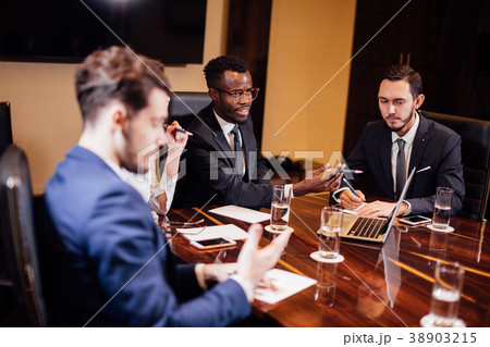 smart business partners using laptop at meeting 38903215