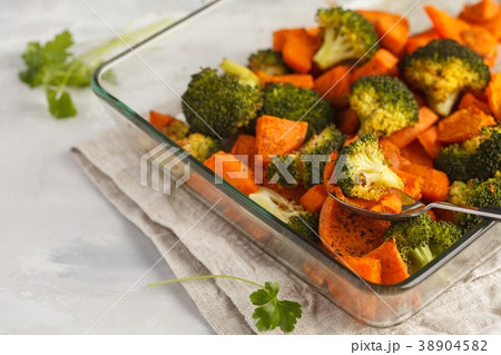 Baked broccoli and sweet potato with spices  38904582