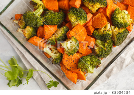 Baked broccoli and sweet potato with spices  38904584