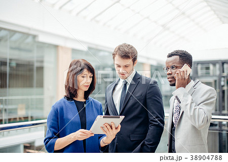 Business people using digital tablet on meeting Business people using digital tablet on meeting 38904788