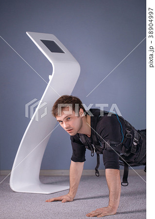 man in Electrical Muscular Stimulation suits doing man in Electrical Muscular Stimulation suits doing 38904997