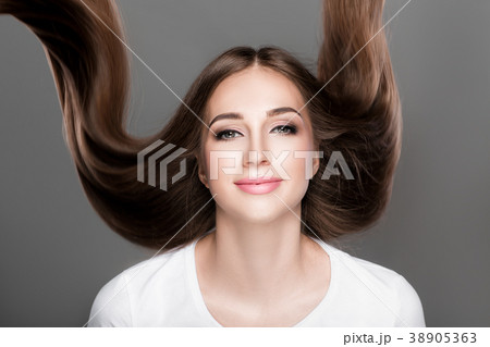 woman with shiny straight long hair. woman with shiny straight long hair. 38905363