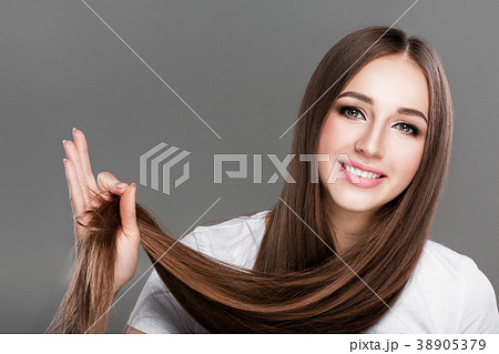 woman with shiny straight long hair. woman with shiny straight long hair. 38905379