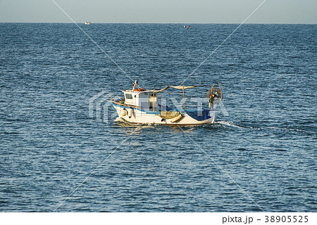 Fishing boat goes to sea 38905525