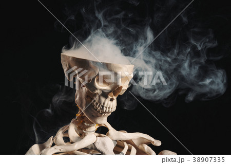 Skeleton with smoke coming out of open skull 38907335