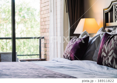 Comfortable pillow on bed Comfortable pillow on bed 38911822
