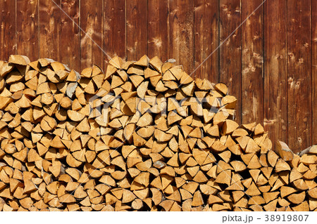 Pile of wood logs background 38919807