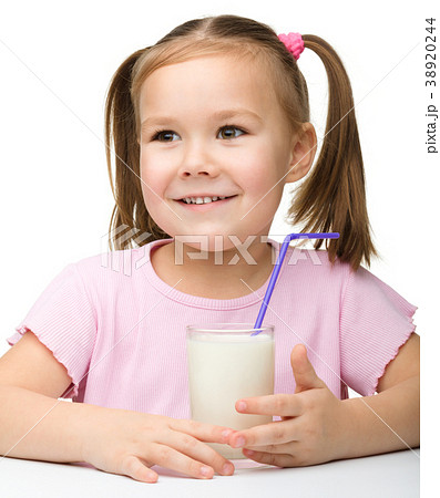 Cute little girl with a glass of milk Cute little girl with a glass of milk 38920244