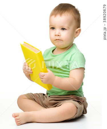 Cute little boy reads a book 38920679