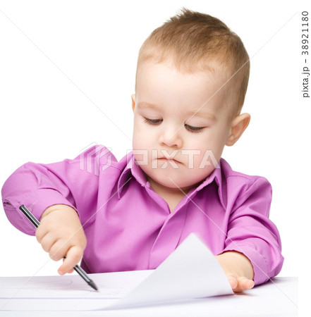 Cute little boy is drawing with pen 38921180