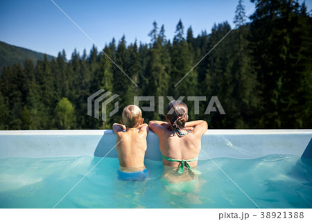 Children in pool looking at picturesque view Children in pool looking at picturesque view 38921388