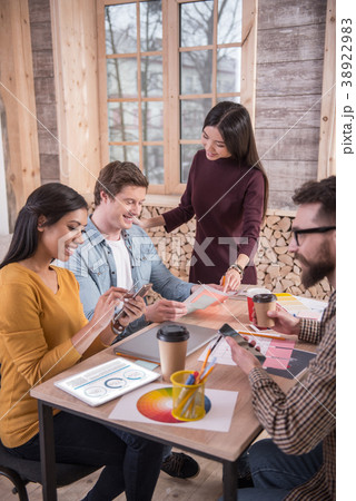 Joyful nice people sitting together Joyful nice people sitting together 38922983