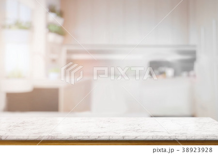 Marble texture table over blurred kitchen bench 38923928